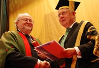 Professor Steve Smith (left) is presented with a commemorative scroll by the University's President, Sir Emyr Jones Parry.